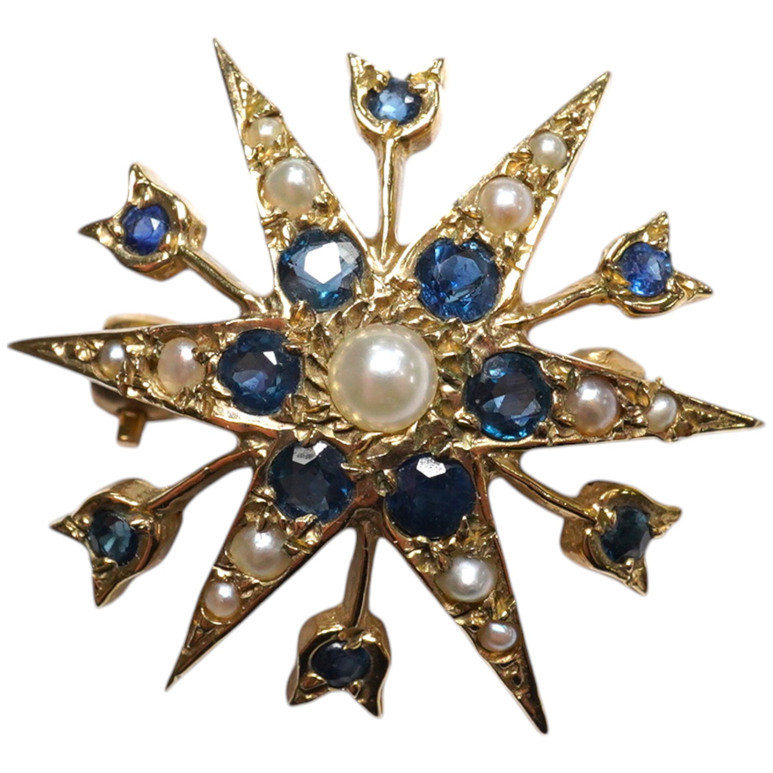 A modern Edwardian style 9ct gold, sapphire and graduated split pearl cluster set starburst brooch, 24mm, gross weight 3.3 grams. Condition - fair to good